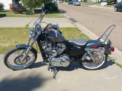Get ready to turn heads with this 2014 Harley Davidson 1200 XL Sportster 72, boasting a sleek design...