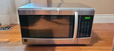 Fully functional Kenmore microwave. 21.5 inches wide. 16 inches deep. 13 inches tall.