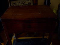Old singer sewing machine in walnut cabinet