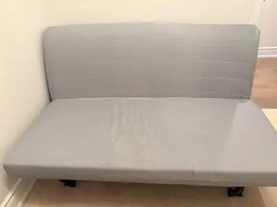 This is an IKEA LYCKSELE series sofa bed, specifically designed as a compact two-seater that quickly...