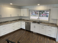kitchen cabinets, counters, sinks, taps