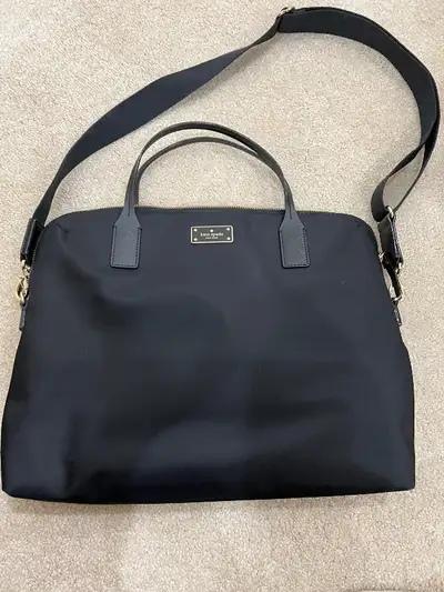 Brand new, authentic and black in colour.