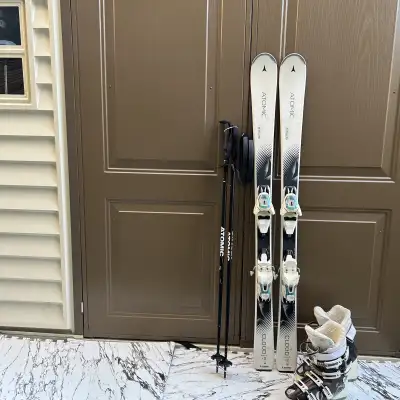 141  Atomic ski with boots  ,poles  , View more