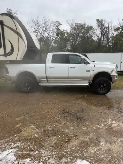 2010 Dodge 4x4 well maintained. Air bags added. 37 12.5 17 tires fifth wheel ball, enthuze tonneau c...