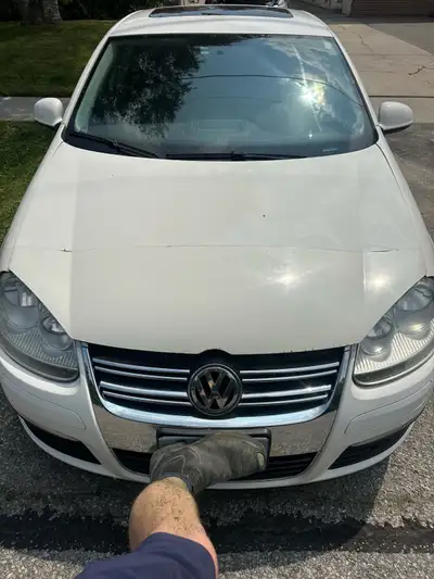 This 2010 Volkswagen Jetta TDI sedan turbo diesel engine. The vehicle shows signs of age and normal...