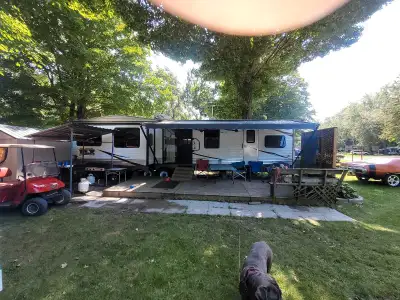 FOR SALE 2016 Wildwood Deluxe 40 ft Park model trailer. Set on a beautifully treed lot, on site 63 a...