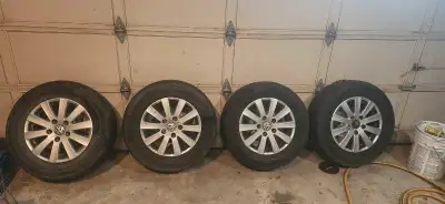 Selling a set of Volkswagen tires and rims, sized at 225/65R16. These are used but still have some l...