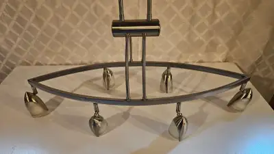 Stainless steel kitchen light. Can be used over a dining table or over an island. Has adjustable LED...