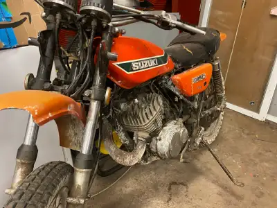 This classic 1972 Suzuki 250 runs snd rides great lots of extra parts rear tire anither motor ect ec...