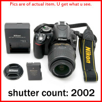Only 2002 shots, Like new Nikon D3100 camera + lens