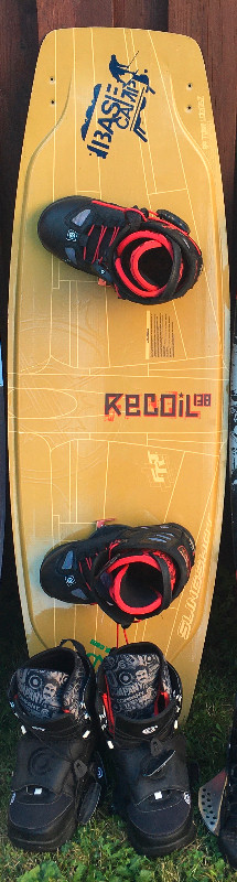 Mens slingshot 138cm wakeboard with size 10,11 bindings in Water Sports in City of Toronto