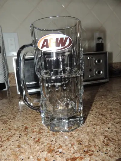 Here's a perfect example of the very desirable A&A tall mug. It is the Canadian version, showing the...