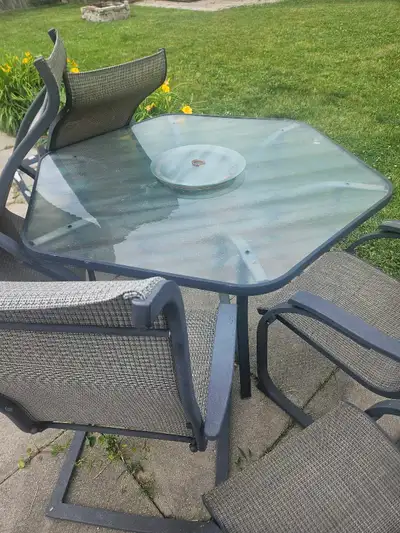 Patio table and 6 chairs, View more