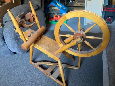 Antique spinning wheel $30 403-317-1107