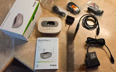 Brand new Phonak TVLink II for Hearing Aids. The TVLink II is used with a streaming device, ie Phona...
