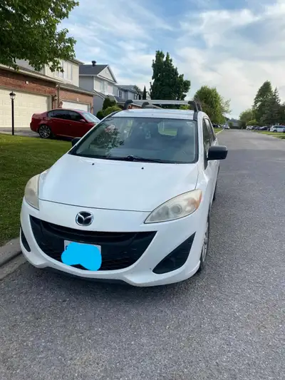 6 passengers mazda minivan, had some work done on it last month, mechanically sound engine and trans...