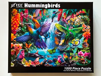 1000-piece "Hummingbirds" jigsaw puzzle, Vermont Christmas Company brand. No pieces are missing. The...