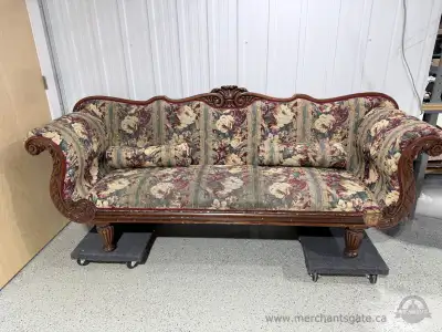Solid hardwood carved frame with scroll arms and decorative crest. Floral tapestry upholstery with b...