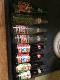 4 Old Pop bottles 3 pop caps 4 beer bottles 2 caps