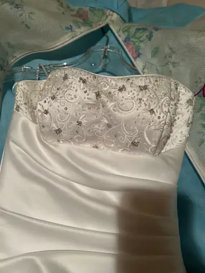 Bought it never worn sat in closet for past twenty years hanging in the bag. Small loop popped on on...