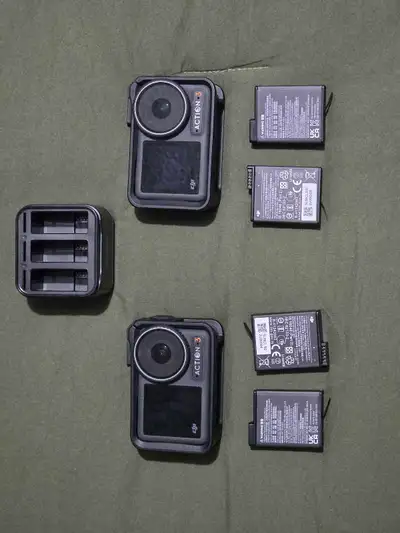 2 x DJI osmo action 3 caneras in excellent condition. 4 batteries. 1 3-battery charging/storage case...