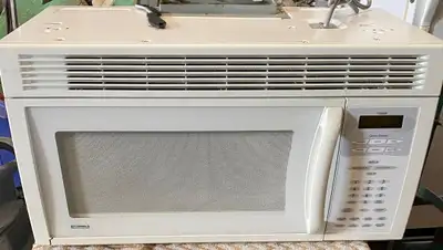 Kenmore microwave oven/hood exhaust fan. Measures 30"x15"x16"high. 1000 W like new condition. $165....