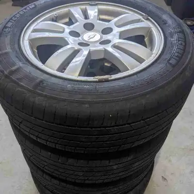 Set of four (195 65/R15) Michelin defender tires mounted on alloy rims, one tire got a nail and has...