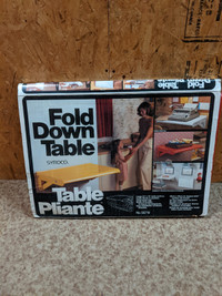 $40 OBO:  Fold down table, colour red, brand Syroco; never used