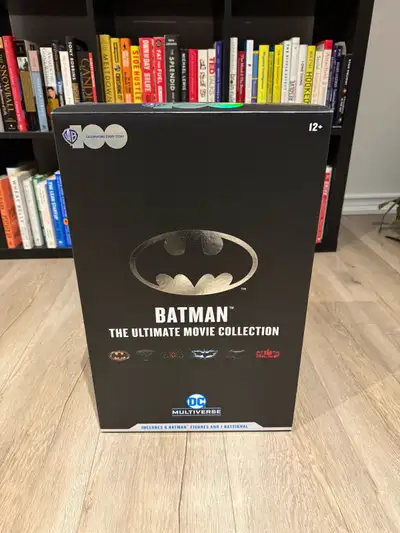 “WB100 Batman The Ultimate Movie Collection – 6 pack”) which includes six 7″ scale Batman figures fr...