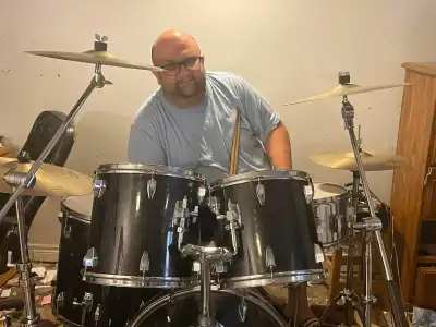 Versatile mature drummer with own gear and transportation looking for gigging or ready to gig band....