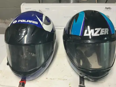 FOR SALE++++. Two Snowmobile/ Motorcycle helmet both size medium one LAZER and one Polaris with flip...