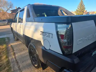 2003 Avalanche 4WD 5.3 V8 Drives and runs good. I'm the 2nd owner. Rusty fender but pretty solid tru...