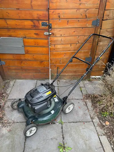 Yardworks push lawnmower. Gas powered engine. 22 inches 139cc. I fixed the carburetor on it and it w...