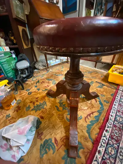 Victorian Walnut Piano Stool With Leather Stud Seat. A walnut piano stool with leather seat and bras...