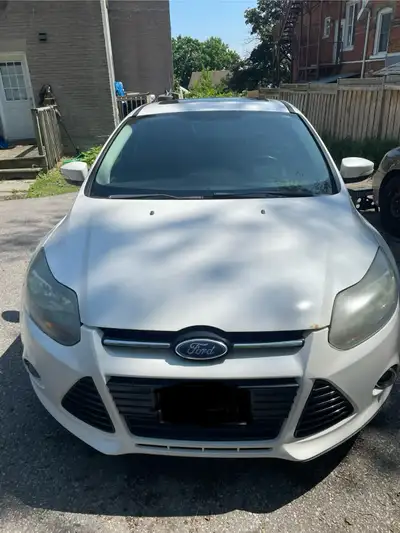 For Sale As Is! Is a 2012 Ford Focus Titanium 4dr hatchback. $3,500.00 O.B.O Needs a rear wheel sens...