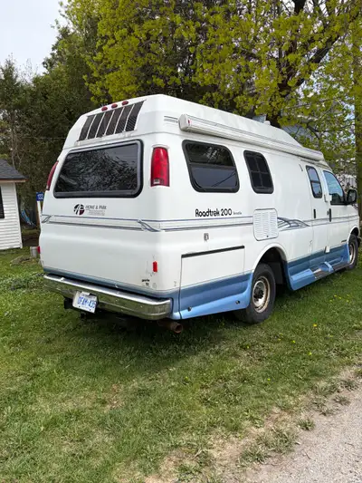 Roadtrek camper van . Needs windshield and front tires . Runs and drives good . 91,000kms priced to...