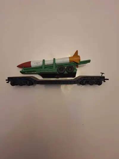 Made by Bachmann 6 axle depressed flat car with load Plastic wheels Horn hook couplers Nothing is br...