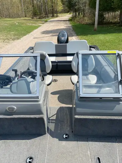 16.5 ft. fishing boat with live well, rod holders, full walk through windshield, boat cover, swivel...