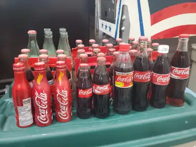 Glass bottles Aluminum bottles Some empty, most full 6 packs All for $100