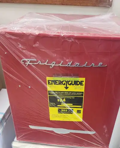 This brand new open box and is new. Frigidaire 1.6 cu. ft. Retro Bar Fridge Colour: RED Comes EXACTL...