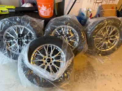 Brand New Bridgestone Blizzaks winter tires on alloy wheels - got for Rav4 but sold the vehicle. Har...