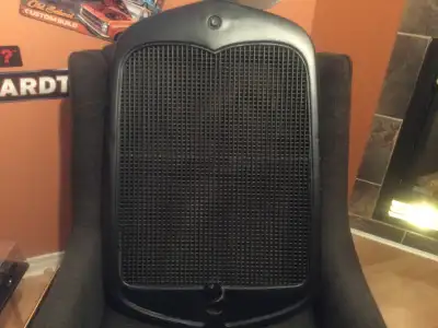 Original steel model A ford grille with unknown mesh protective insert. Original grille with crank h...