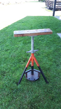 Rigid adjustable tri-pod stand with added weight for stability