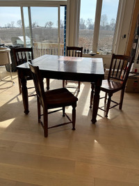 Solid wood dining table with extension and 5 matching chairs