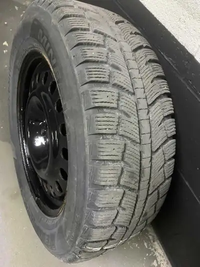 4 winter tires mounted on black painted rims for a fresh look, no structural damage. Size 225/65R17...