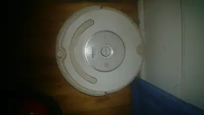 Good condition comes with two virtual walls and home base charger. Battery only holds a short charge...