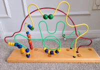 Wood bead maze roller coaster