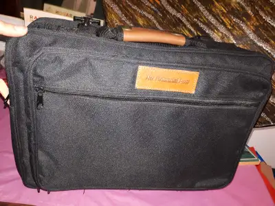 Selling a briefcase/laptop case in excellent condition. Comes with shoulder strap, very roomy "THE F...