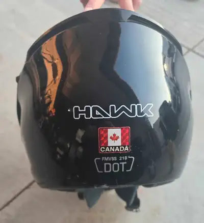 This is a Hawk motorcycle helmet, designed for safety on the road. It's been gently used, but it's s...