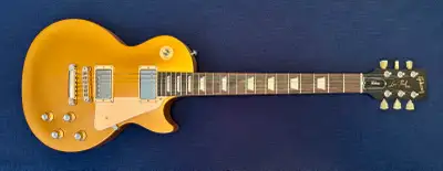 This is a beautiful guitar. The satin gold top immediately draws a lot of attention. This guitar has...